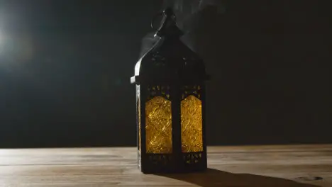 Stationary Shot of Smoke Pouring Out of a Lantern During Ramadan Celebrations