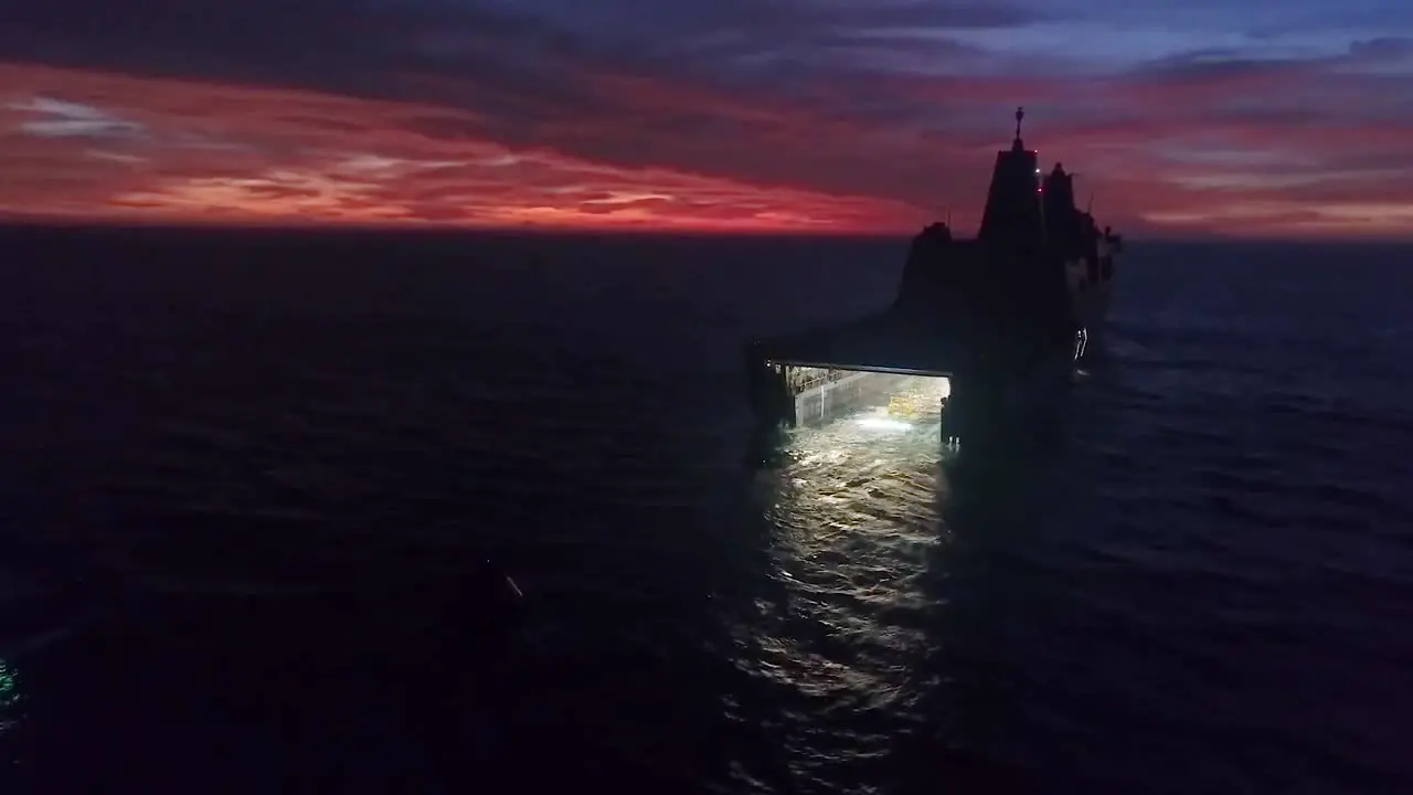 Aerial Drone Footage Of A Large Military Boat Loading A Test Re Entry Spacecraft Into Its Hatch Sunset 2019