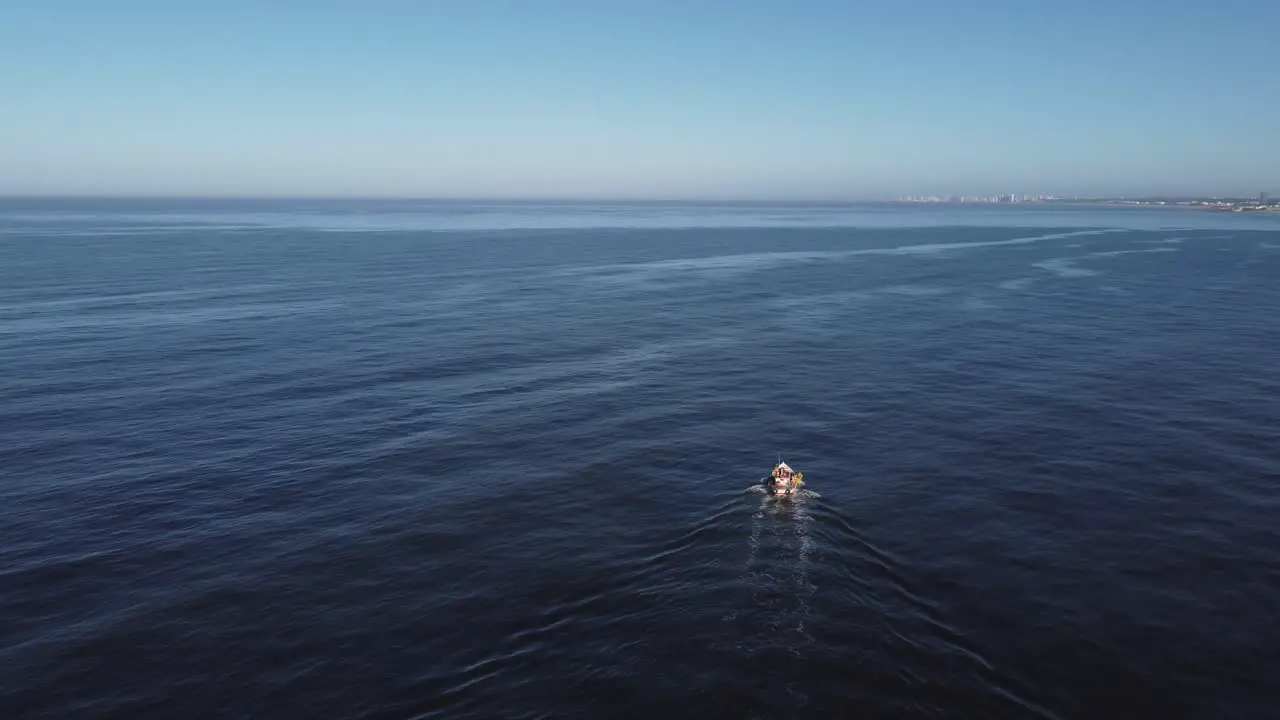 Fishing boat navigating along Uruguayan coast in South America