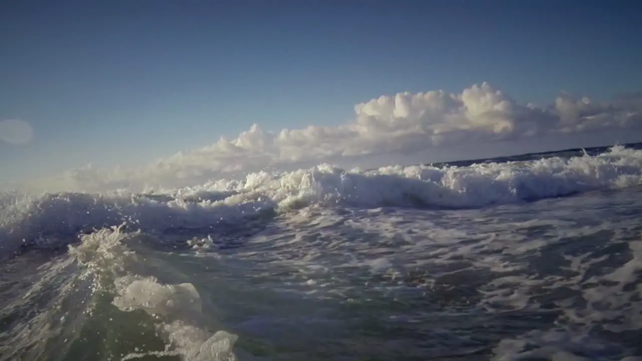 POV shot of waves crashing into shore including underwater perspective 2