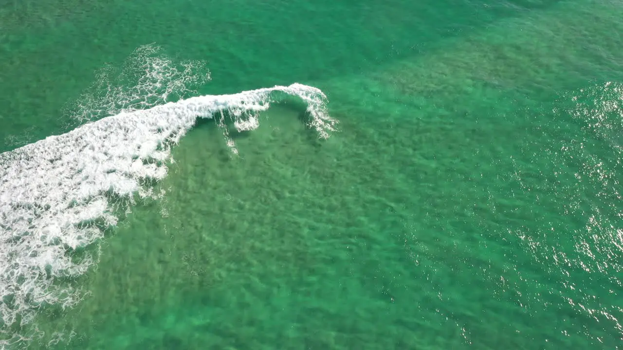 Aerai view over pristine crystal clear water and vertical panning towards North Stradboke Island beaches in Queensland Australia