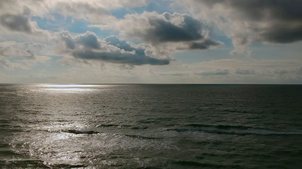 Relaxing morning on the beach looking at the ocean with a drone