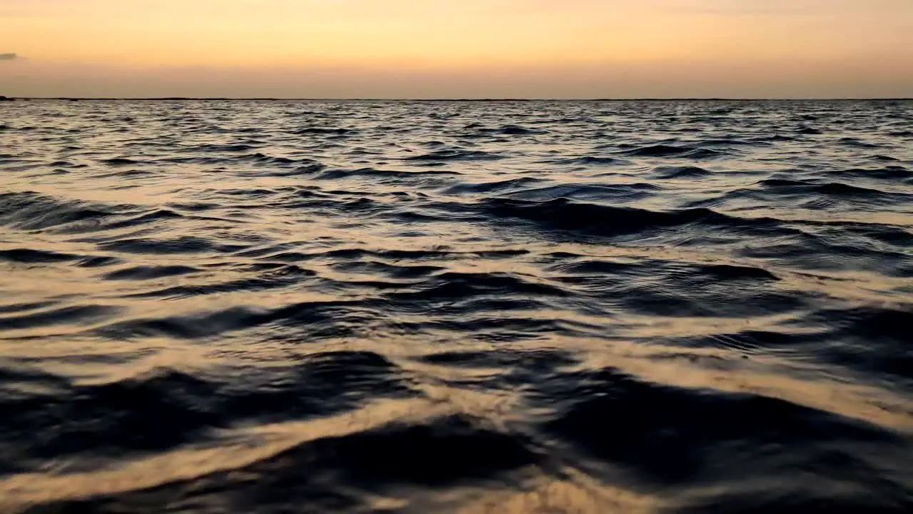 quiet sea ripples at sunset