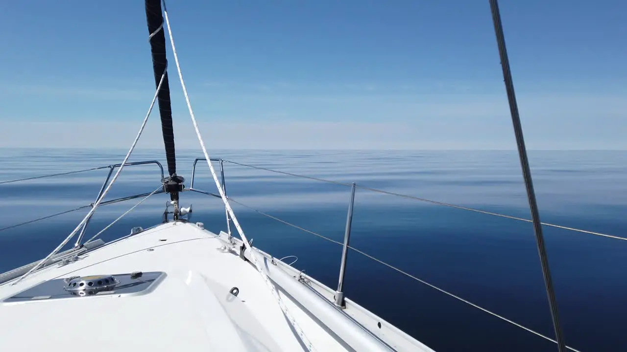 Lake Michigan Sailboat on clear water across lake or ocean no waves and clear skies