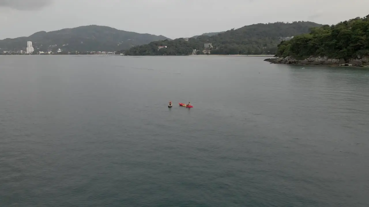 Canoes in the ocean close to beach in Thailand