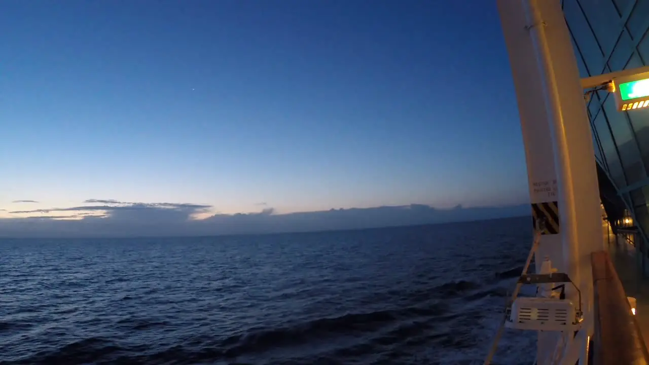 Walk along the deck of a cruise ship looking at the sea