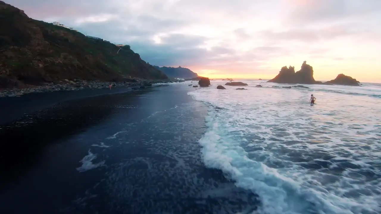 Fpv shot of the beach Anaga in Canary Island very close to the ground in the sun set