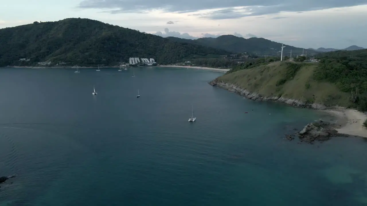 Pier between mountains with boats