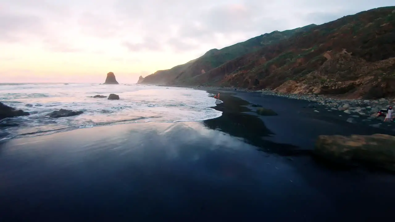 Fpv shot of the beach too close to the ground in the sun set in Tenerife Canary Island