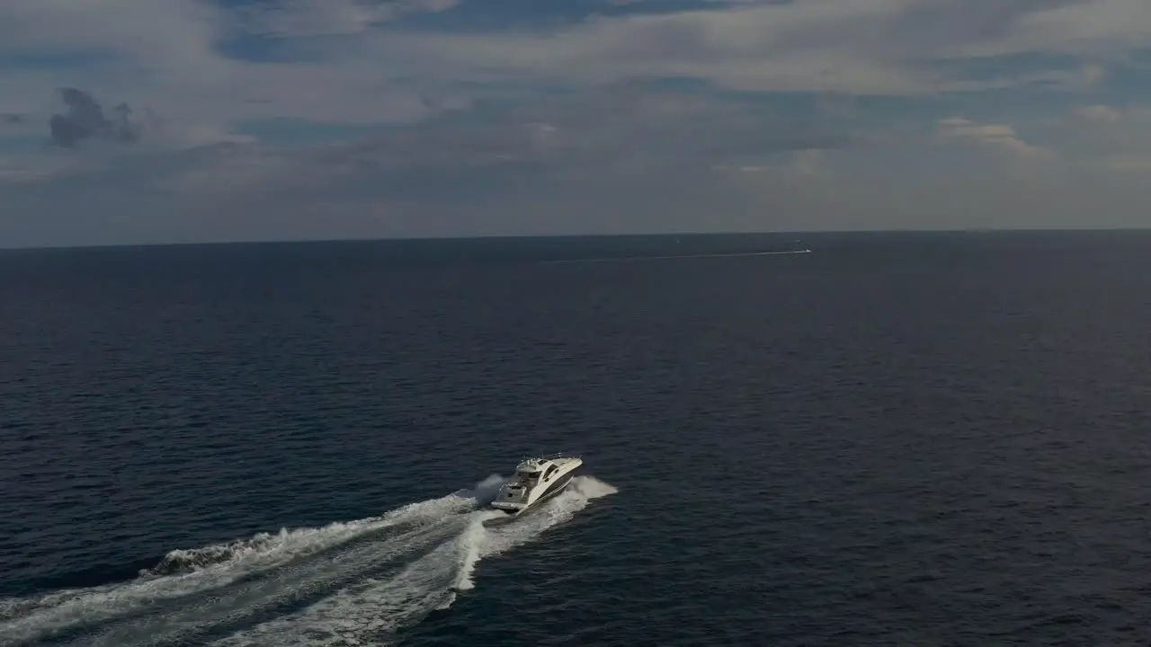 aerial of small yacht along a florida coast