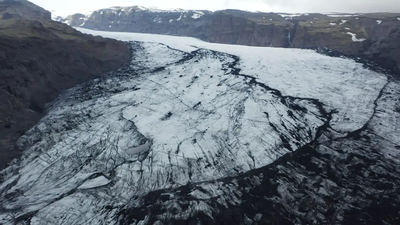 Sólheimajökull glacier in Iceland Ice mass floe in between mountain range