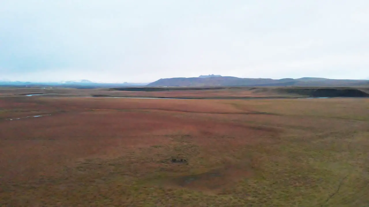 Rough windswept grass plains in nordic heath landscape Iceland