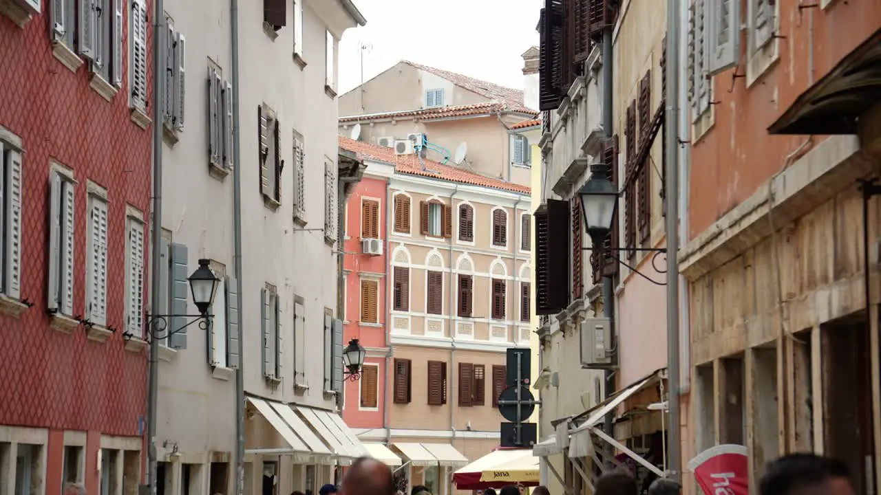 Residential apartments above a narrow street