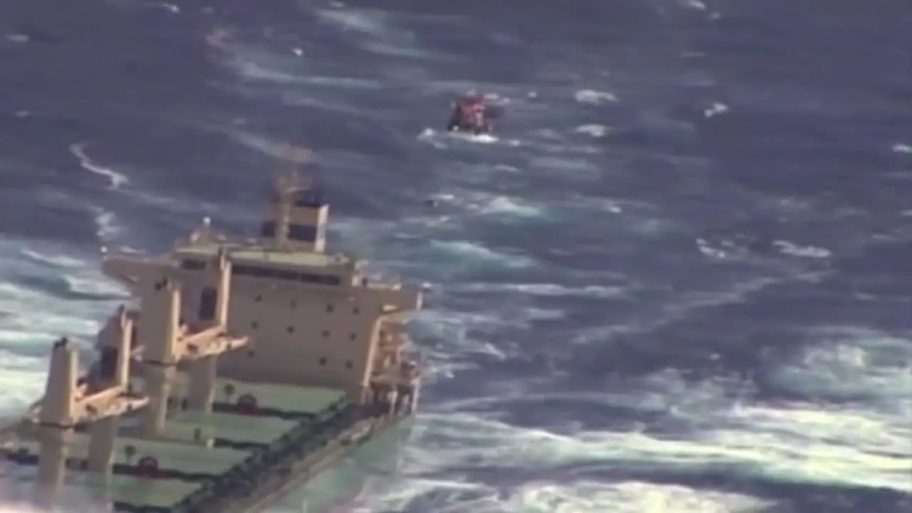 News Footage Of The Coast Guard Flying Above A Cargo Ship On The High Seas And Rescuing Or Airlifting A Crewman 3