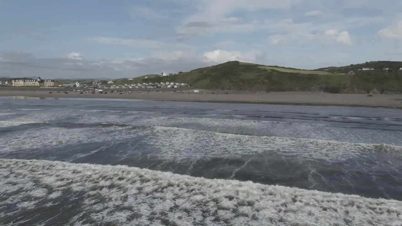 Drone shot of waves crashing on a beach in Ireland