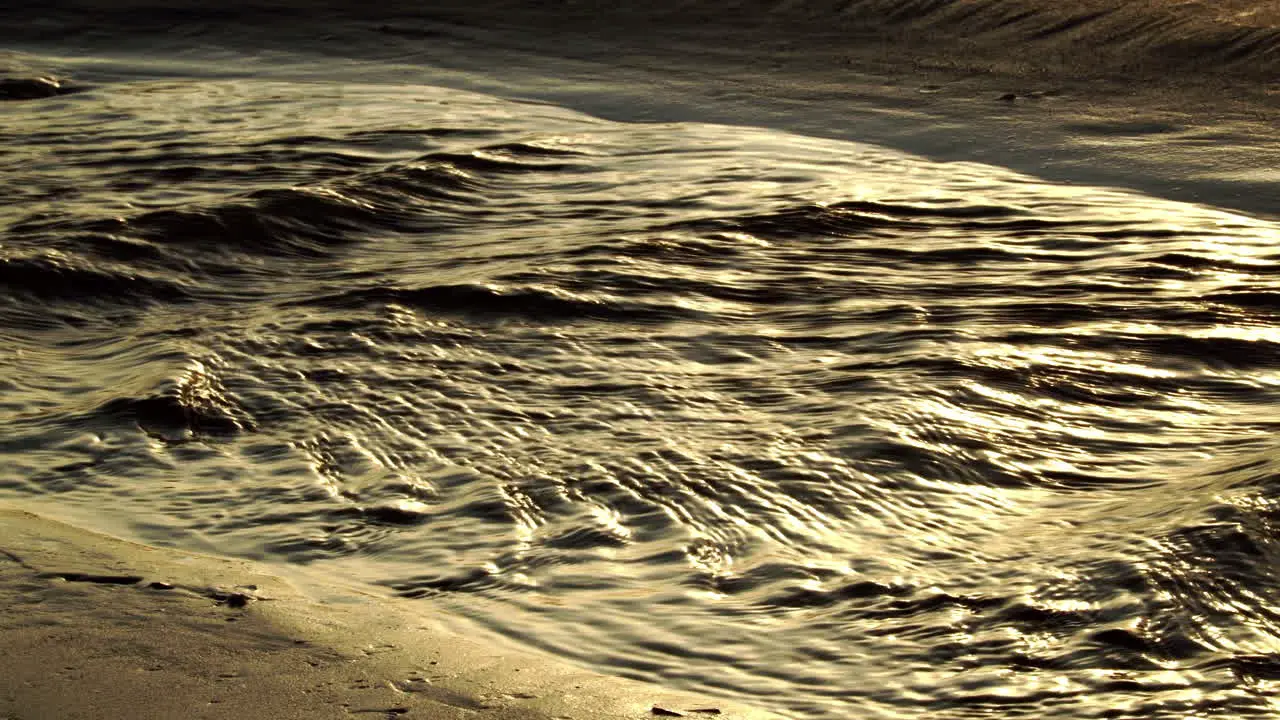 Fast flowing water stream near sandy coastline of Vietnam static view