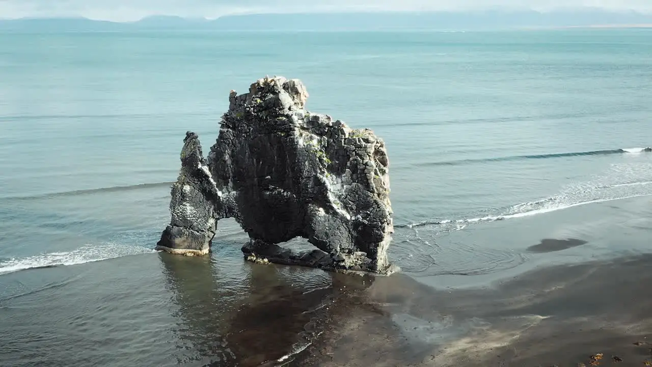 epic aerial footage of black rock on the beach in Iceland