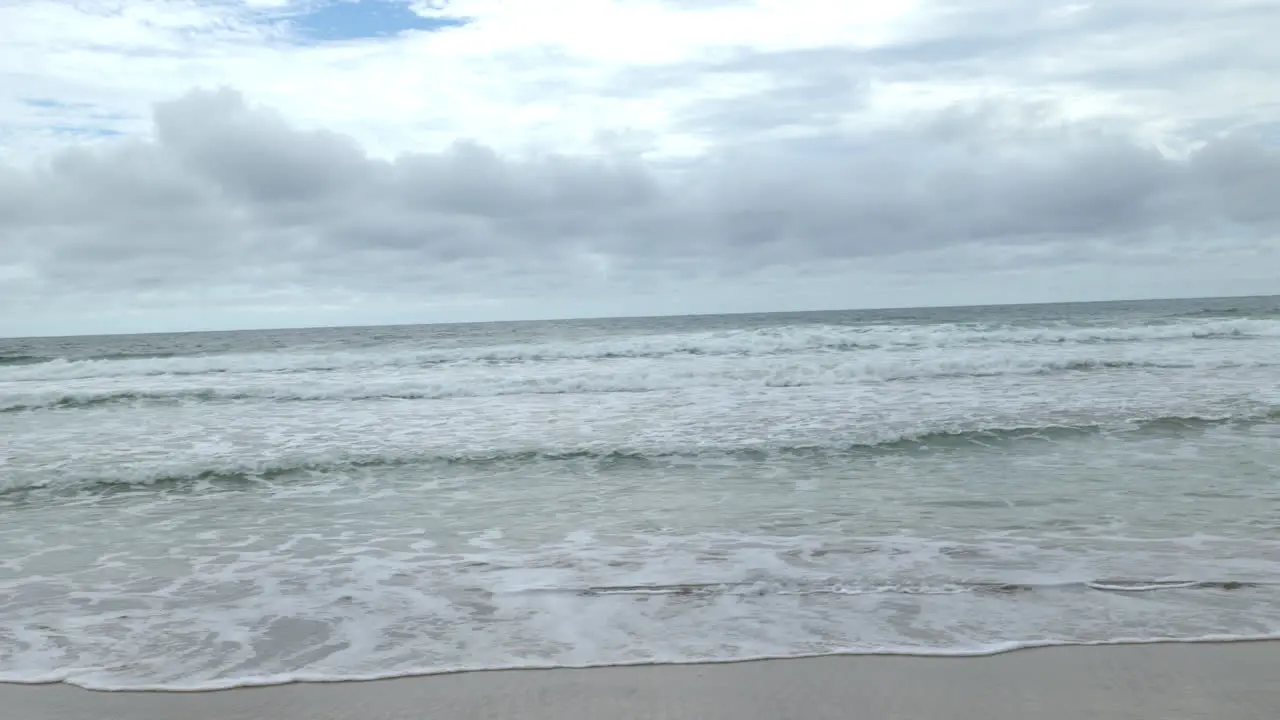 Panning of a paradise beach on a cloudy