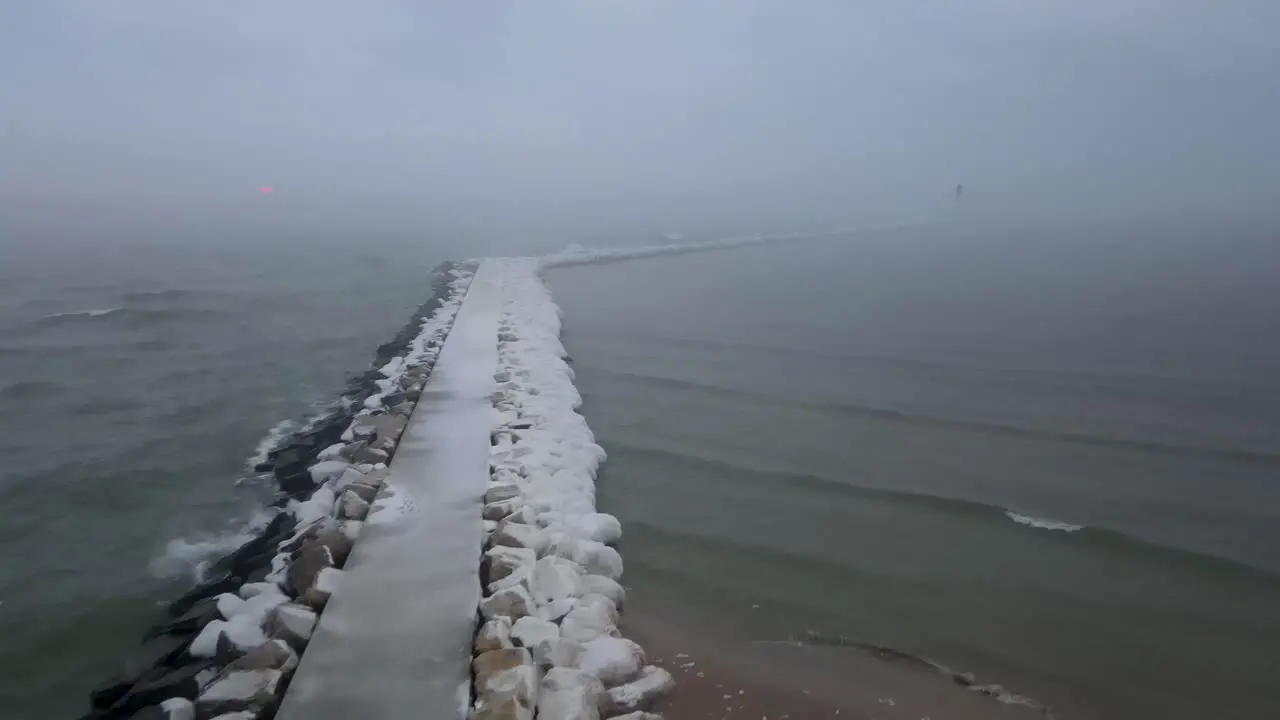 Snow melting off the surface of Lake Michigan and Rising into Mist