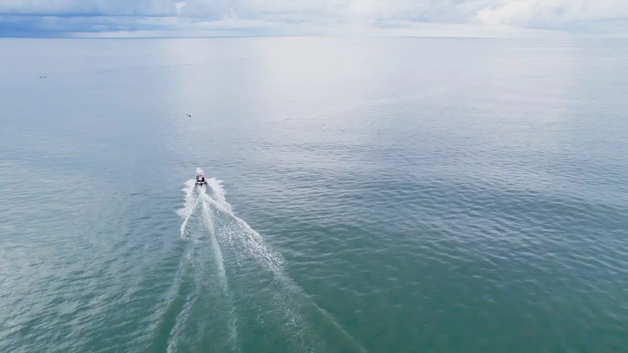 Motorboat driving through the open ocean