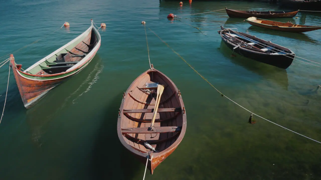 Several Wooden Boats Are Moored Off The Coast The Peaceful Landscape Of A Fishing Village 4k Video