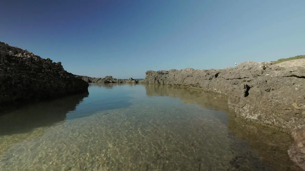 Rock pool on beach on tropical island