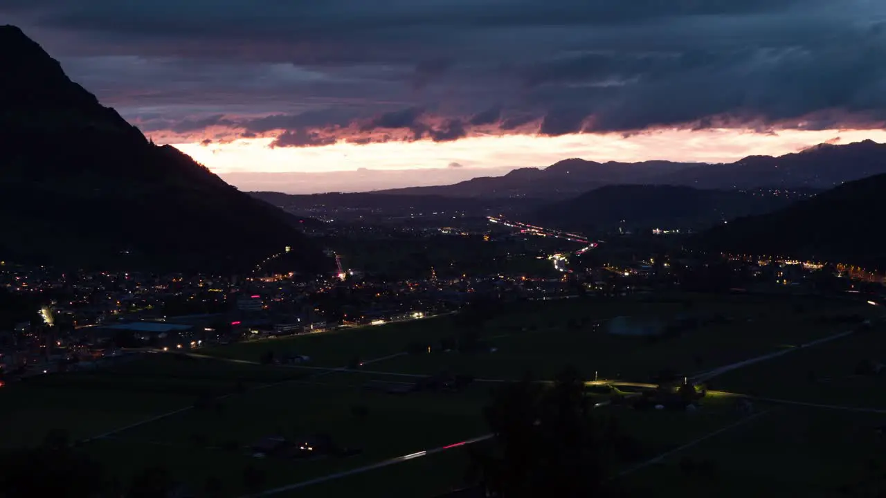 Panorama night timelapse view of Swiss valley during National Day with fireworks