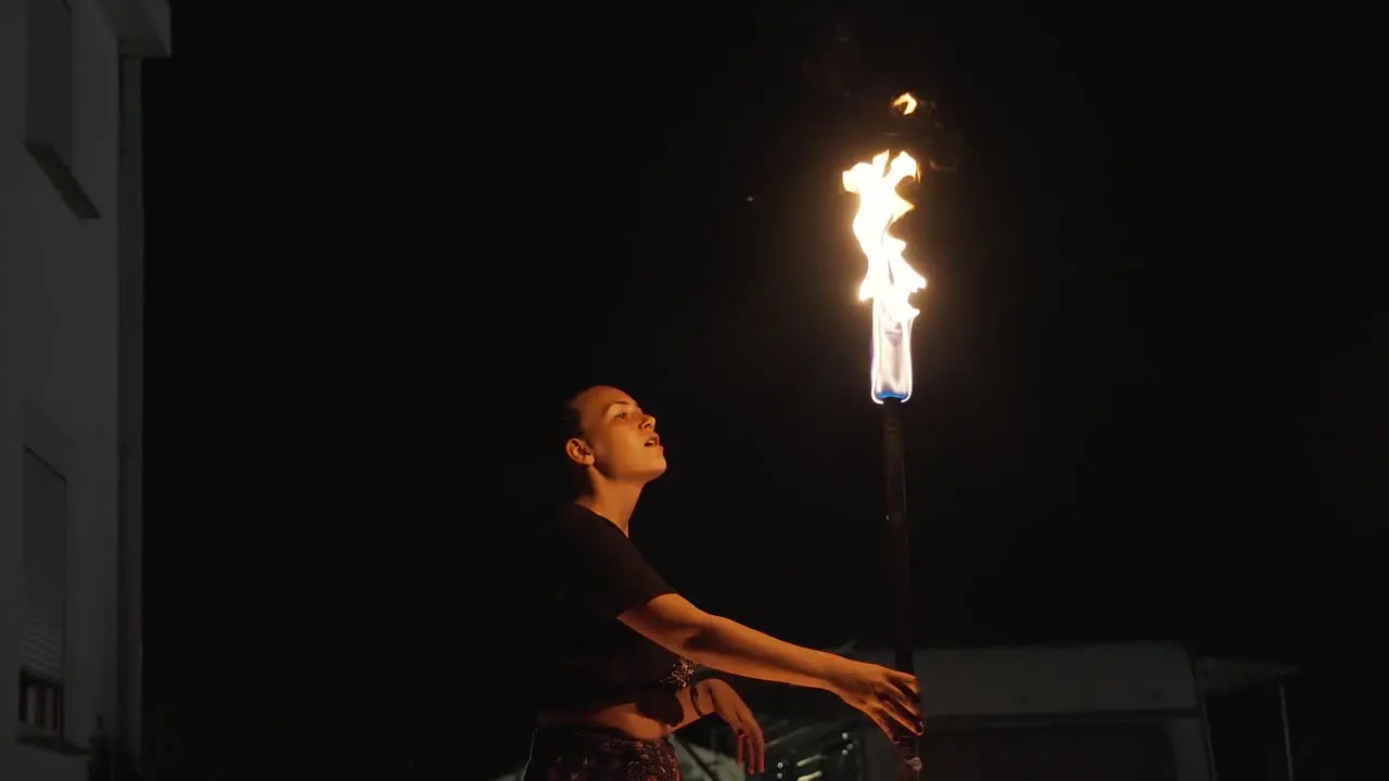 The darkness of night is the perfect backdrop for this artist performing a thrilling fire show