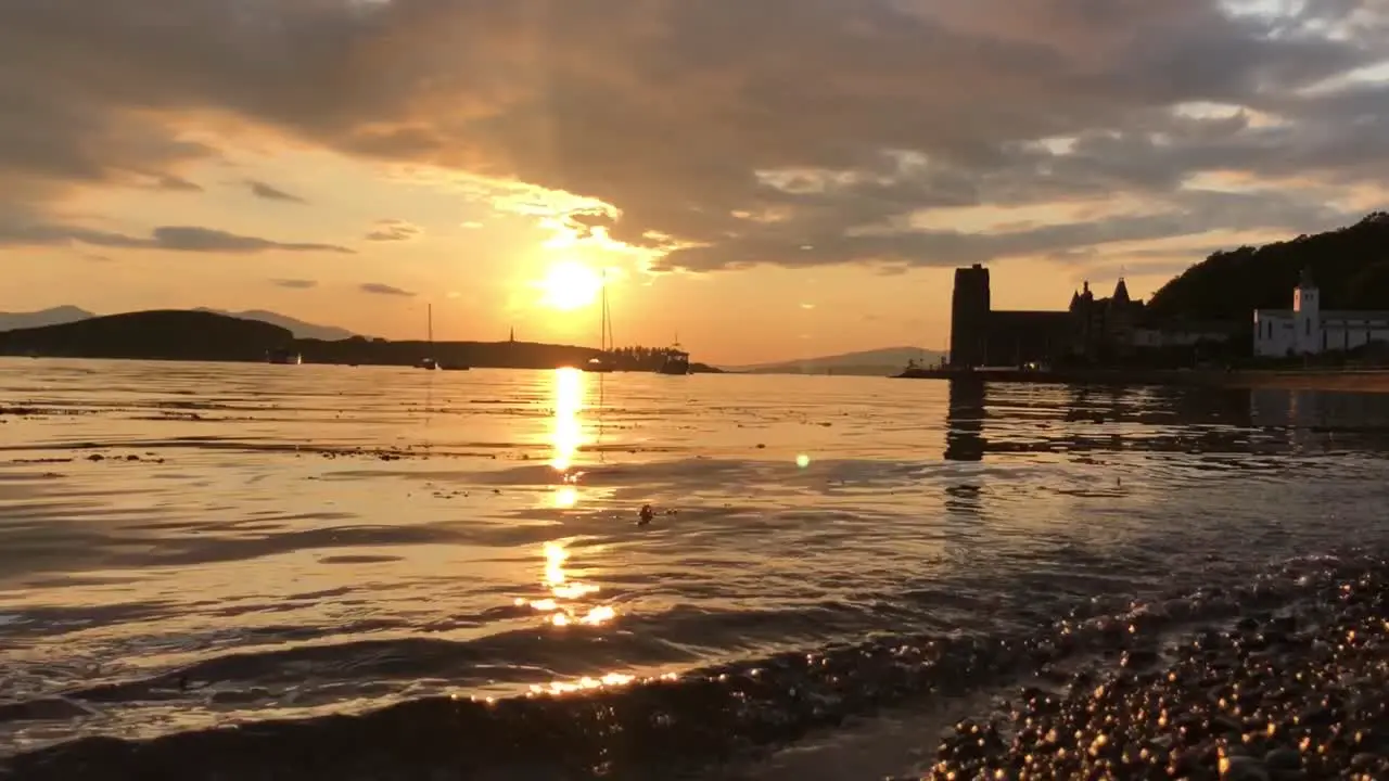 A Stunning Sunset Across Oban Bay with Kerrera and a Cathedral as Silhouettes | Oban Scotland | HD at 60 fps