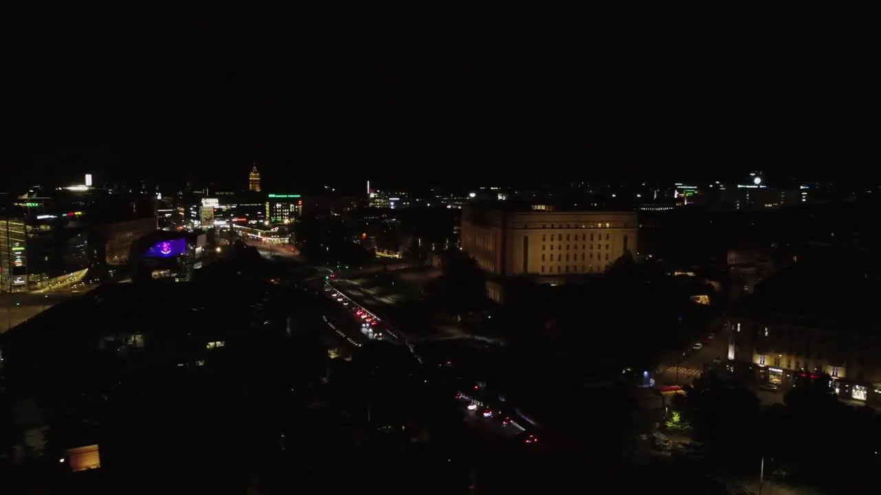 Parliament House dominates black night aerial in downtown Helsinki