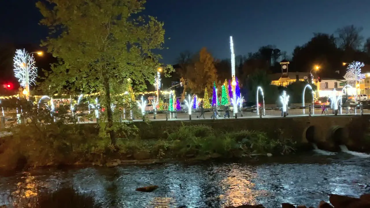 Small city night Christmas light over a river