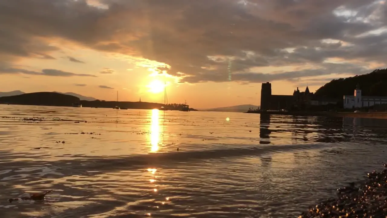 A Stunning Sunset Across Oban Bay with Kerrera and a Cathedral as Silhouettes | Oban Scotland | Slow motion HD at 30 fps