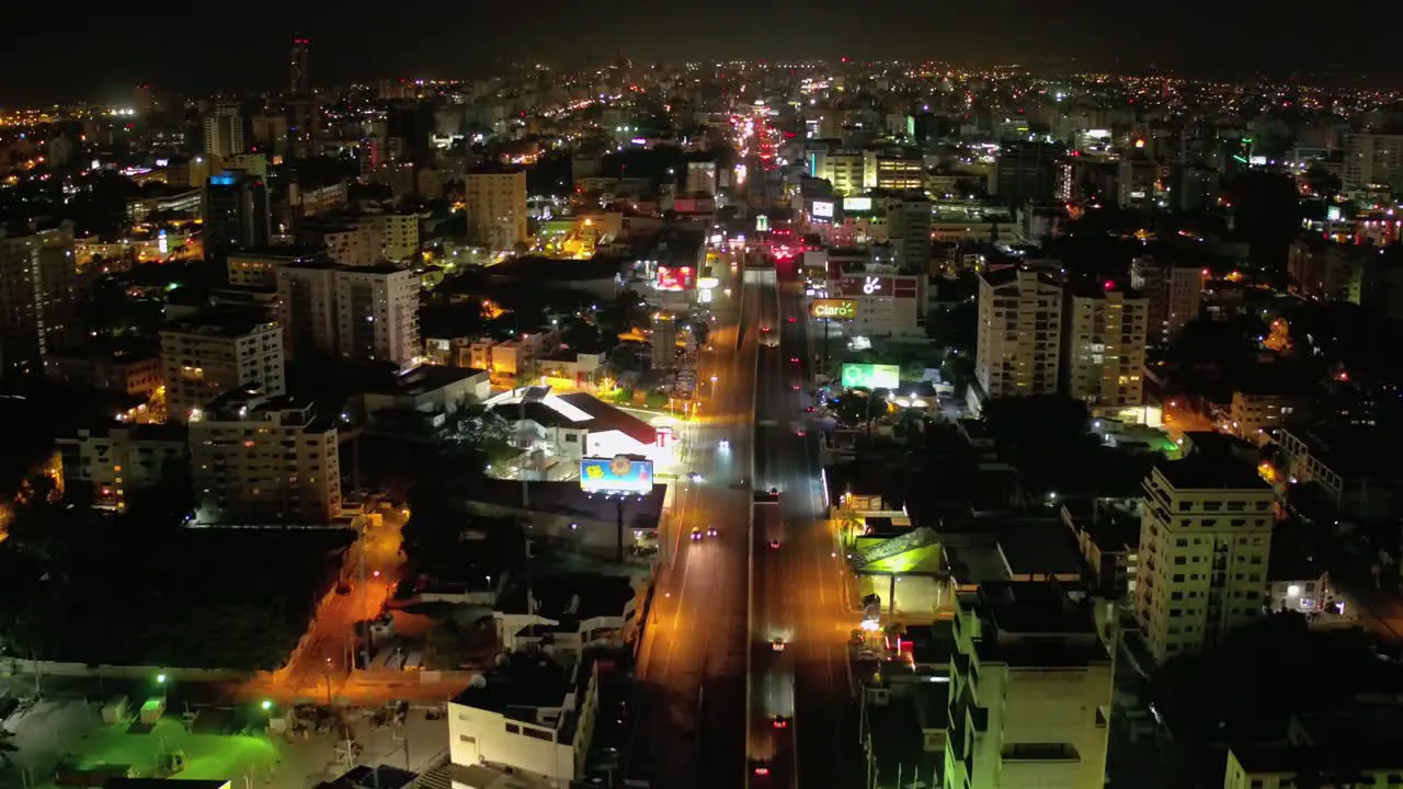 Forward flight on 27 de Febrero Avenue Santo Domingo Dominican Republic in one night shot with drone