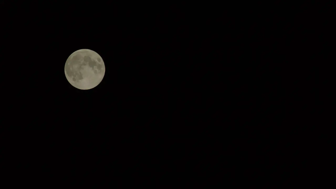 Full moon against a dark sky evoking mystery and the beauty of the cosmos