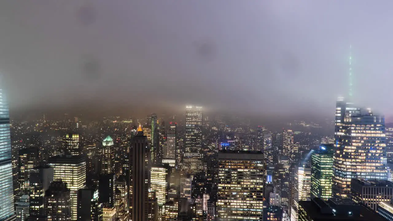 Stormy View of New York City Skyline at Night Panning Timelapse raindrops popping