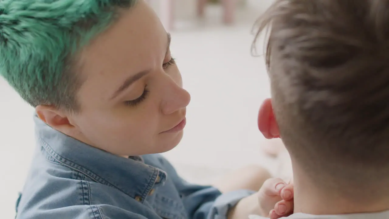 Close Up Of Loving Woman Tenderly Caressing Her Boyfriend's Head At Home