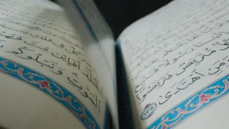 Macro Shot of Turning Quran Pages