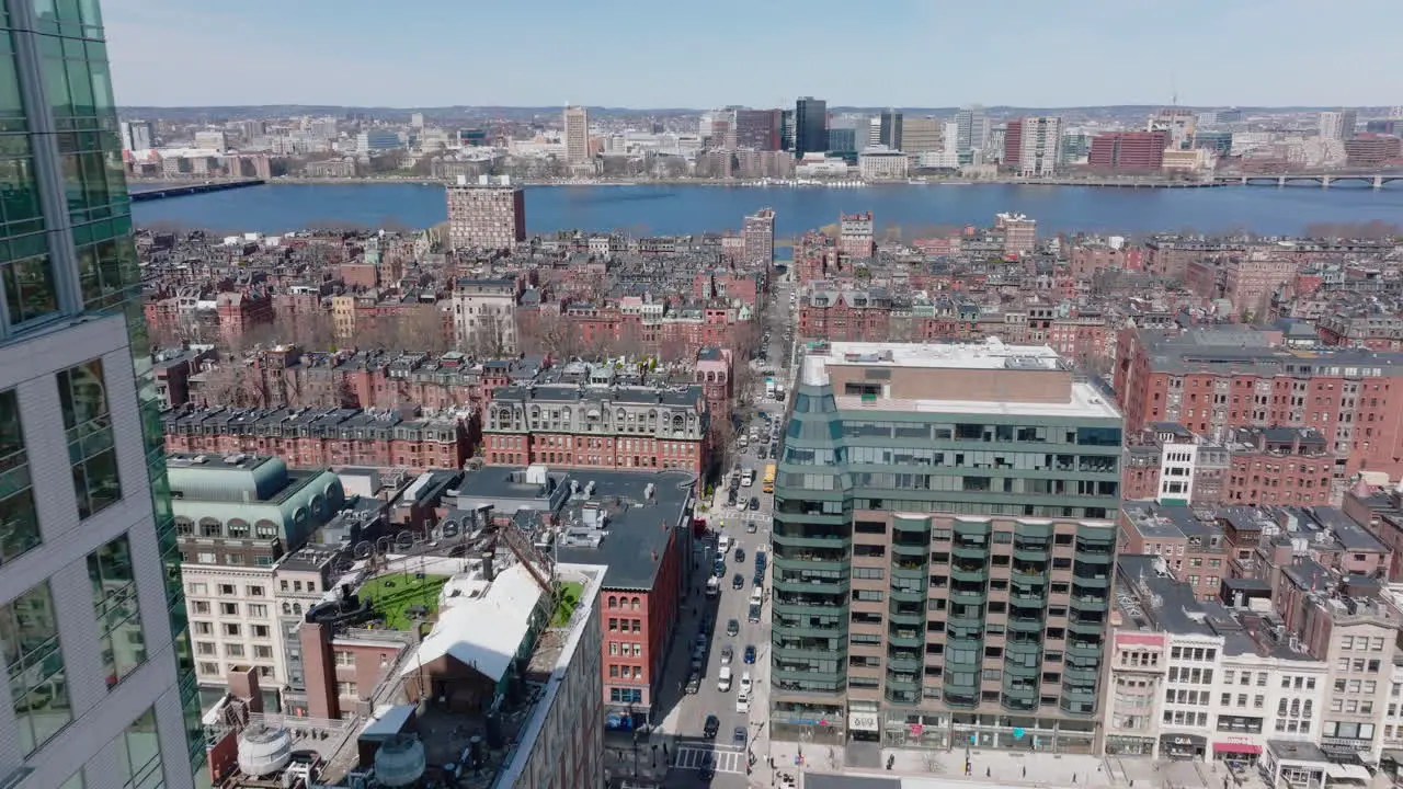 Residential district from height Fly around modern high rise building panoramic view of red brick buildings and Charles river waterfront Boston USA