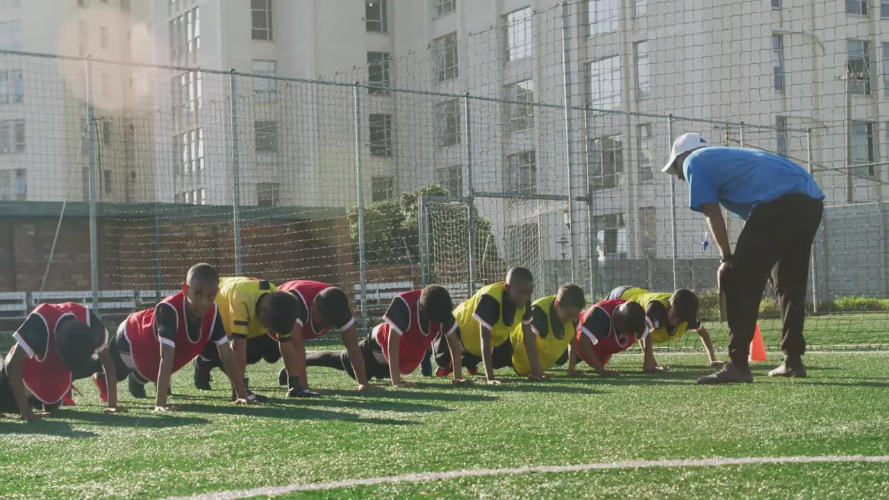 Soccer kids exercising in a sunny day