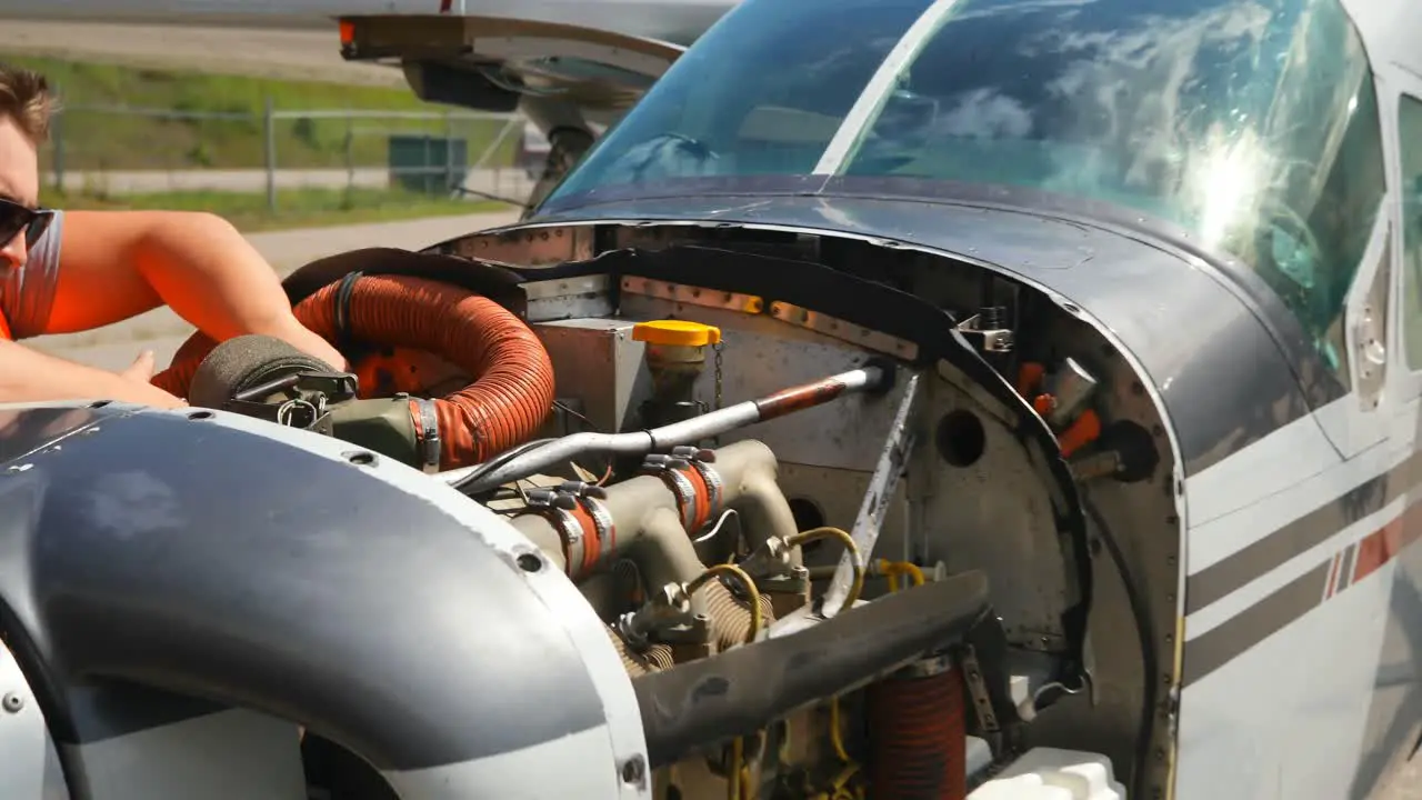 Engineer servicing aircraft engine 4k