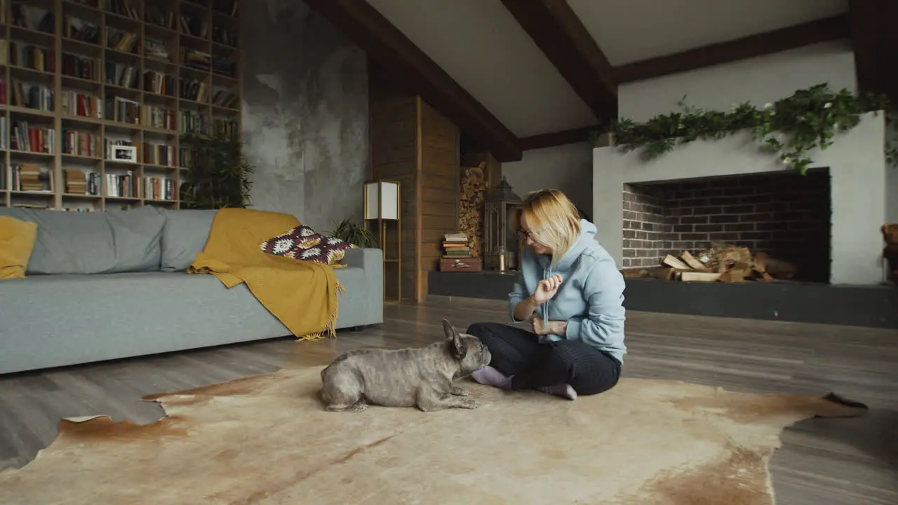 Red Haired Woman And Her Bulldog Dog On The Carpet On The Living Room Floor 1