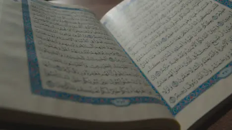 Handheld Shot of the Quran Religious Text Pages