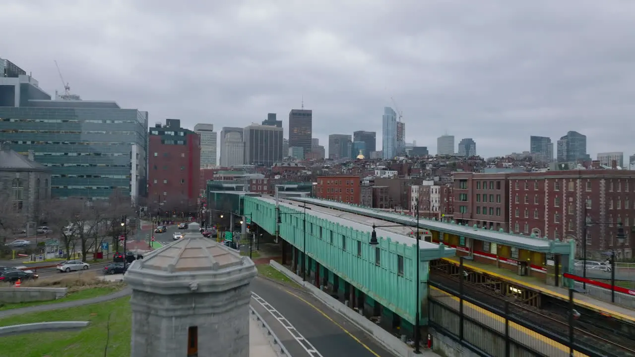 Forwards fly along train stop in city Subway units driving on overground track on cloudy day Boston USA