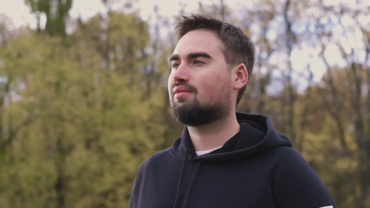 Bearded Man Breathing Fresh Air Standing In The Park In The Morning