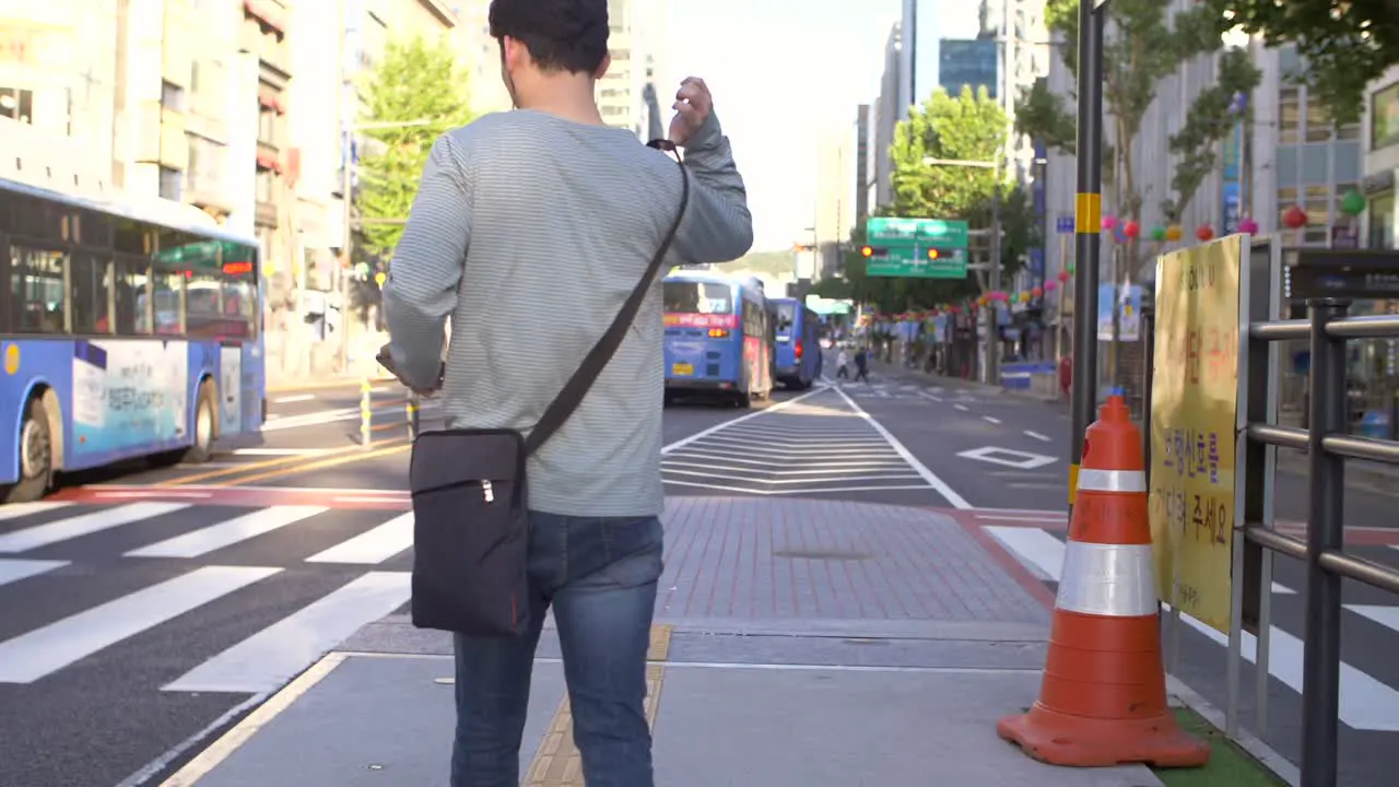 Man Walking Through Downtown Seoul