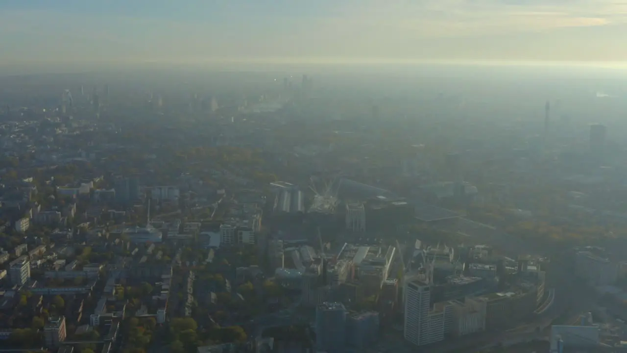 High aerial slider shot over kings cross industrial area looking towards central London