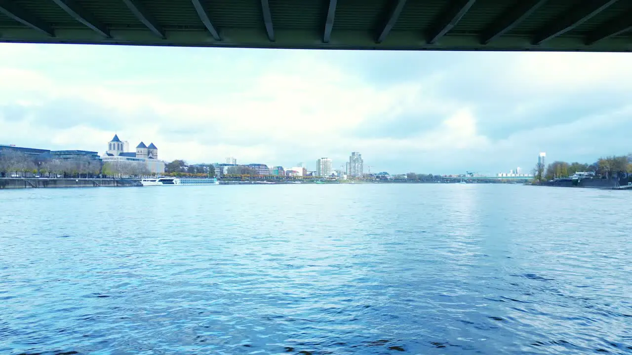 Drone flight under bridge on the Rhein river in Cologne Germany on a cold Autumn morning