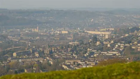 Pedestal Shot Rising Up Over Small Hill and Revealing City of Bath