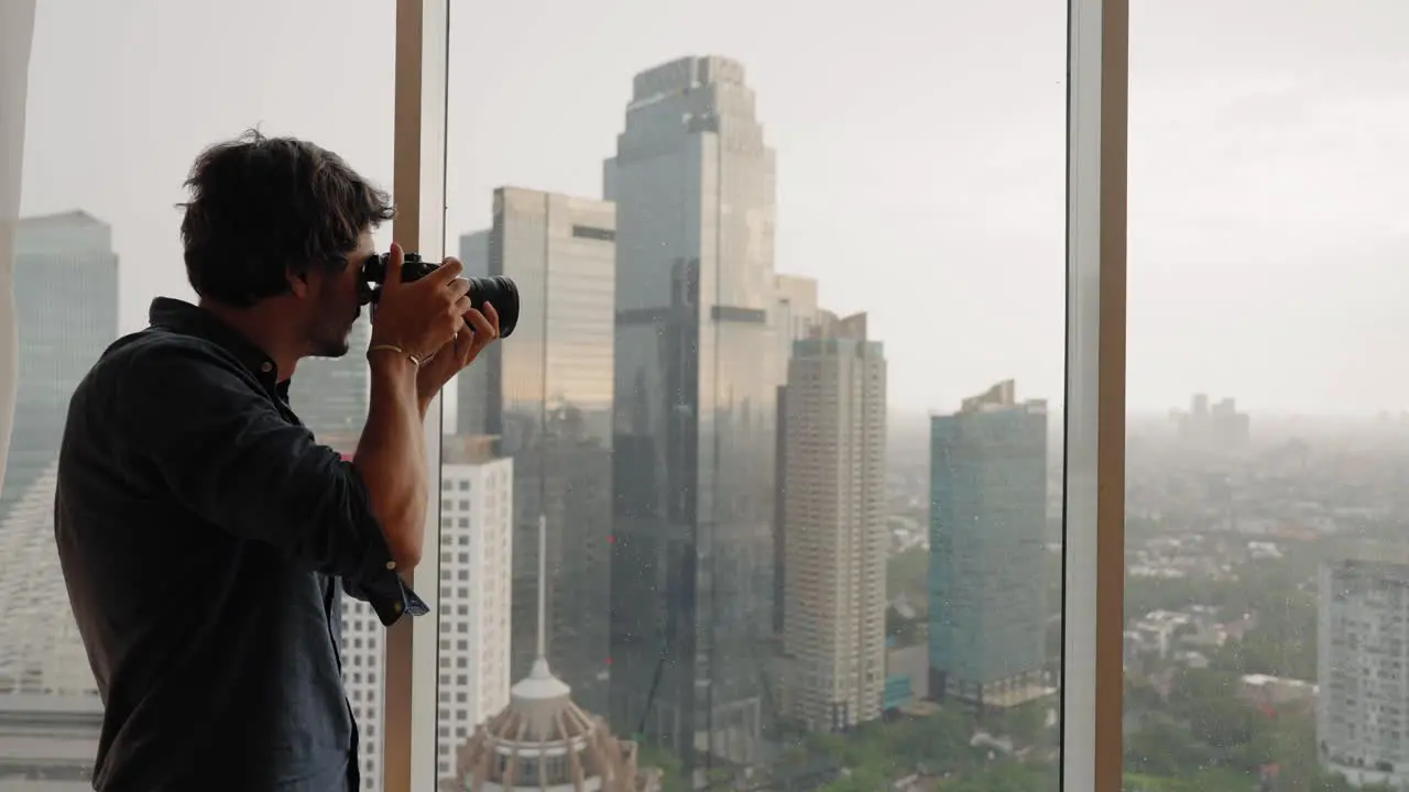 Long Shot of Man Taking Photos of Jakarta