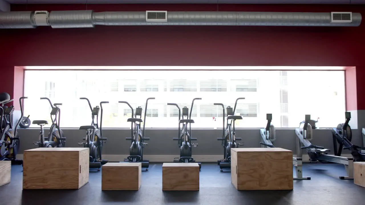 A modern gym interior with exercise equipment with copy space